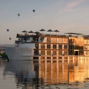 Nile cruise with hot air balloons in background