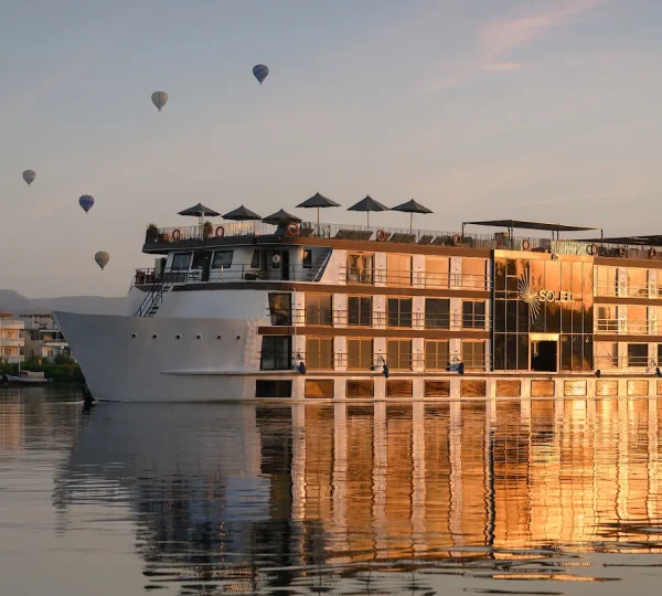 Nile cruise with hot air balloons in background